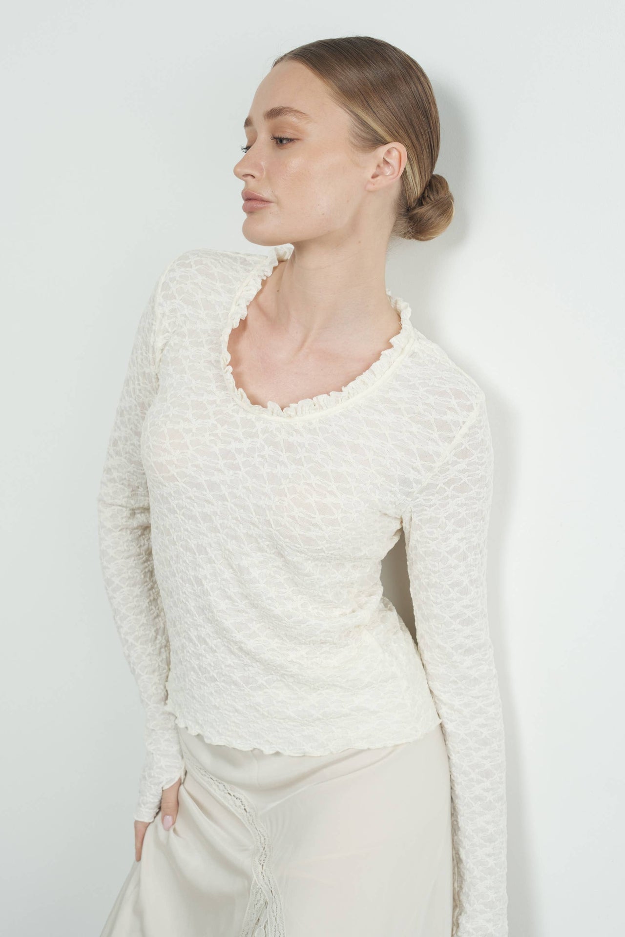 Elegant Cream Lace Long-Sleeve Top with Ruffle Details and U-Neckline